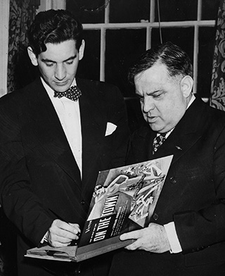 Bernstein autographing his new recording of On the Town for New York's Mayor Fiorello LaGuardia